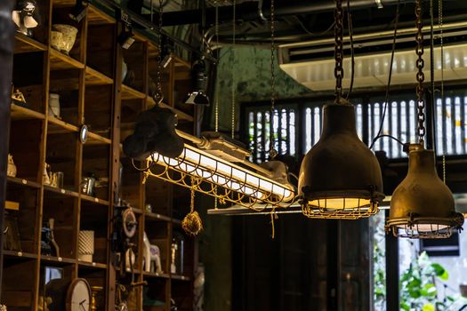 Bangkok, Thailand - Jun 26, 2020 : Vintage Interior design house. Decoration of wooden wall shelves and old lamps. No focus, specifically.