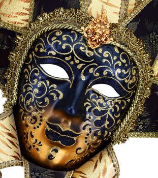 A Black and gold Venetian carnival mask close up
