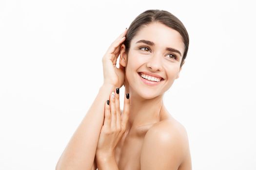 Beauty and spa concept - Charming young woman with perfect clear skin over white background