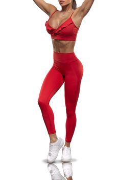 legs brunette girl in red leggings and a top on a white background