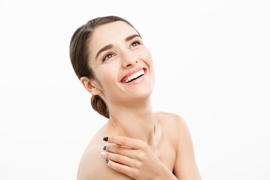 Beauty and spa concept - Charming young woman with perfect clear skin over white background