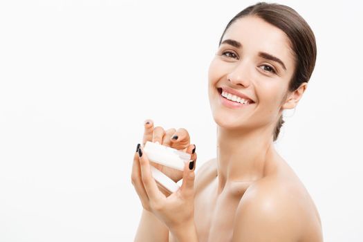 Beauty Youth Skin Care Concept - Beautiful Caucasian Woman Face Portrait smiling and holding cream jar for body and skin.Isolated over white background