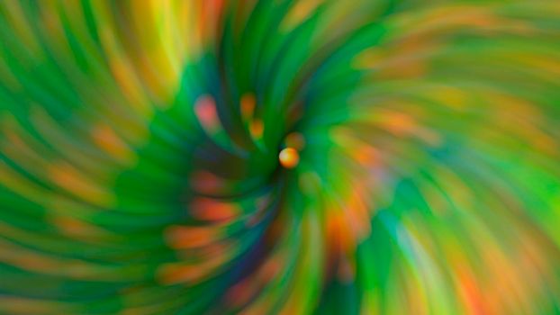 Abstract blurry green background with rainbow highlights.