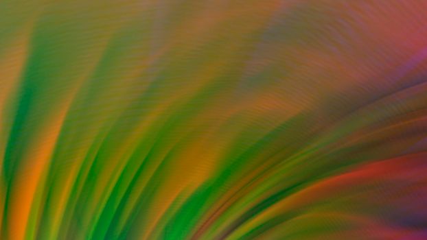 Abstract blurry green background with rainbow highlights.