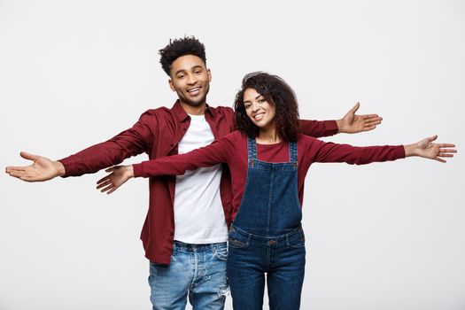 Happy young African couple dressed casually having fun together