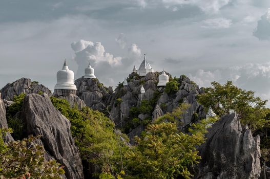 Lampang, Thailand - Sep 03, 2020 : Pagoda on top of the cliff high mountain at Chaloem Phrakiat Phrachomklao Rachanuson temple (Wat Phrabat Pu Pha Daeng) Chae-Hom District, Lampang province, Unseen and Amazing temple in Thailand. Selective focus.