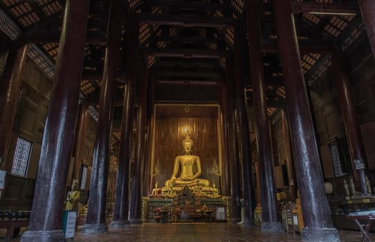 Chiangmai, Thailand - Sep 07, 2020 : The buddha image in main vihan at wat phun tao. Wat phan tao is a beautiful wooden temple in chiang mai. Selective focus.