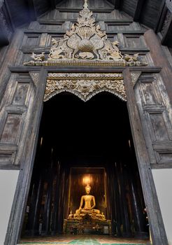 Chiangmai, Thailand - Sep 07, 2020 : The buddha image in main vihan at wat phun tao. Wat phan tao is a beautiful wooden temple in chiang mai. Selective focus.