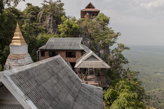 Lampang, Thailand - Sep 03, 2020 : Pagoda on top of the cliff high mountain at Chaloem Phrakiat Phrachomklao Rachanuson temple (Wat Phrabat Pu Pha Daeng) Chae-Hom District, Lampang province, Unseen and Amazing temple in Thailand. Selective focus.