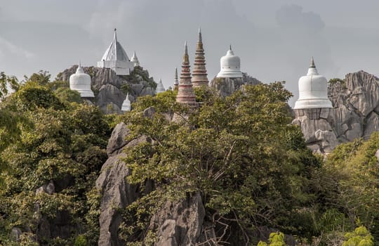 Lampang, Thailand - Sep 03, 2020 : Pagoda on top of the cliff high mountain at Chaloem Phrakiat Phrachomklao Rachanuson temple (Wat Phrabat Pu Pha Daeng) Chae-Hom District, Lampang province, Unseen and Amazing temple in Thailand. Selective focus.