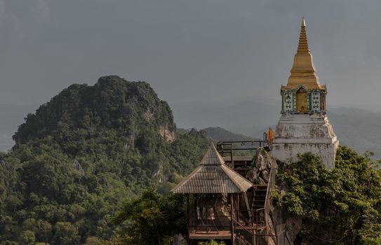 Lampang, Thailand - Sep 03, 2020 : Pagoda on top of the cliff high mountain at Chaloem Phrakiat Phrachomklao Rachanuson temple (Wat Phrabat Pu Pha Daeng) Chae-Hom District, Lampang province, Unseen and Amazing temple in Thailand. Selective focus.