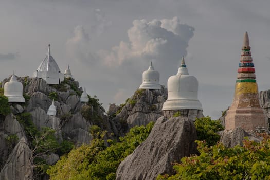 Lampang, Thailand - Sep 03, 2020 : Pagoda on top of the cliff high mountain at Chaloem Phrakiat Phrachomklao Rachanuson temple (Wat Phrabat Pu Pha Daeng) Chae-Hom District, Lampang province, Unseen and Amazing temple in Thailand. Selective focus.