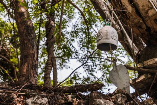 Bell shaped bell, Bodhi leaf at The ancient of a 200 year old church front. Wat Pah Krathum. Selective focus.