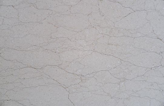 Close up of cracked concrete floor texture.