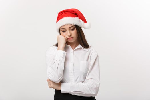 Business Concept - Modern caucasian business woman in christmas theme with serious thoughtful pose.