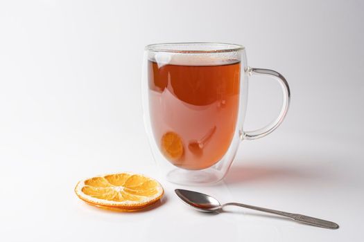 glass thermo mug with black tea on a white background. High quality photo
