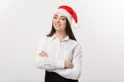 Business Concept - Modern caucasian business woman in christmas theme arm crossed posing on white studio background with copy space.