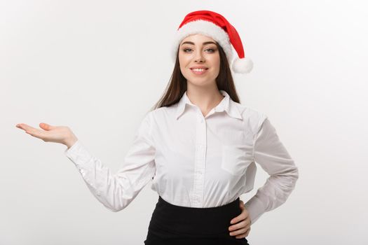 Business Concept - Modern caucasian business woman in the white studio background holding hand onside presenting product.