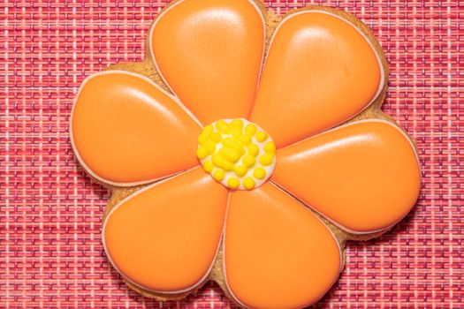 ginger cookies in the form of a flower on a red background. High quality photo