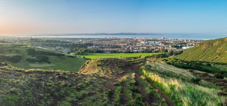 Panorama Of Edinburgh, Scotland, Including Holyrood Palace And Calton Hill, As Taken From Arthur's Seat On A Beautiful, Clear Summer Evening