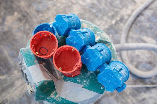 A set of plastic inserts for red and blue sockets. Construction vacuum cleaner