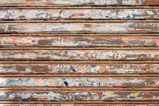 Old metallic store blinds with signs of usage