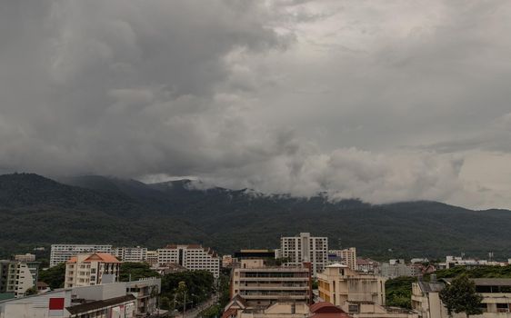 View City in Chaing mai and Doi Suthep mountain in background at Thailand. No focus, specifically.