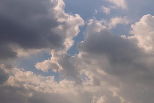 The cloudy beautiful sky with the light shining from the sun. The softness of the cloud creates a feeling of relaxation. copy space, Selective focus.
