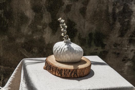 Dried flowers in Handmade Ceramic Vases on Wooden Board. Home decor, Space for text.