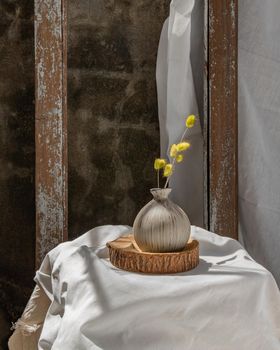 Dried flowers in Handmade Ceramic Vases on Wooden Board. Home decor, Space for text.