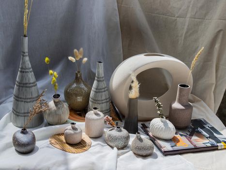 Bangkok, Thailand - Sep 26, 2020 : Handmade Assorted Many Different Ceramic Vases on white table. Home decor, Space for text.