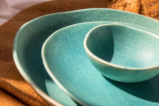 Detailed of Ceramic Plates on Sackcloth. Home decor, Ceramic tableware, Beautiful arrangement.