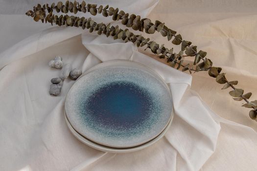 Set of Ceramic Plates with Dried flowers on Calico. Ceramic tableware, Beautiful arrangement.