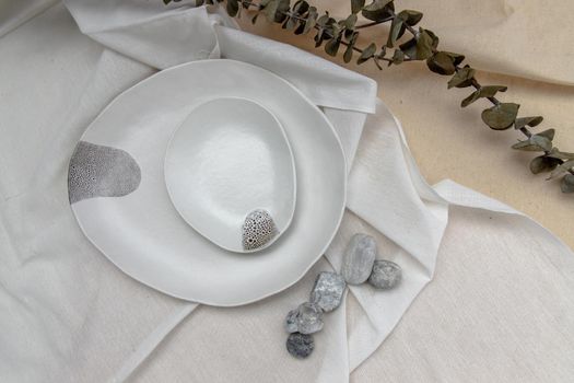Set of Ceramic Plates with Dried flowers on Calico. Ceramic tableware, Beautiful arrangement.