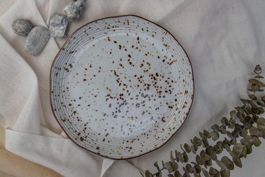 Ceramic Plates with Dried flowers on Calico. Ceramic tableware, Beautiful arrangement.