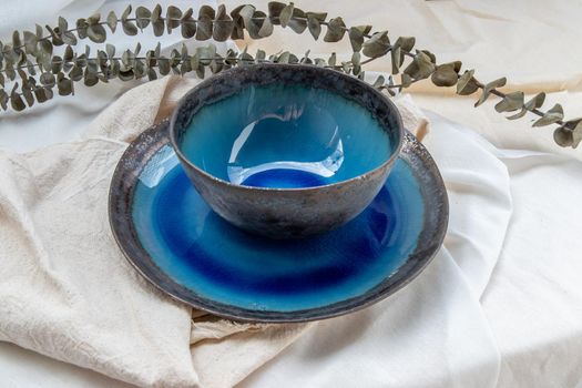 Set of Ceramic bowl with Dried flowers on Calico. Ceramic tableware, Beautiful arrangement.
