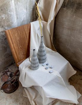 Handmade Double ceramic Vases on wooden chair. Home decor, Space for text.