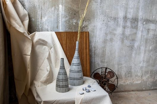 Handmade Double ceramic Vases on wooden chair. Home decor, Space for text.