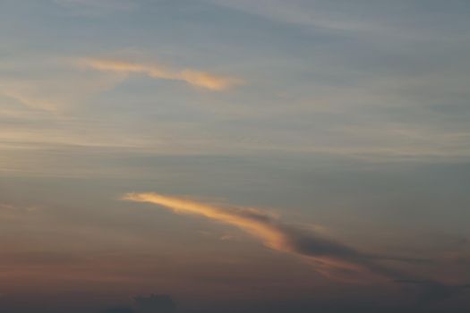 Beautiful sunset sky above clouds with dramatic light, Beautiful blazing sunset landscape, Horizon. Warm Colours, copy space.