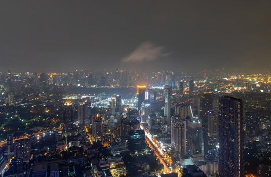Bangkok, thailand - Nov 07, 2020 : Bangkok downtown cityscape with skyscrapers at night give the city a modern style. No focus, specifically.