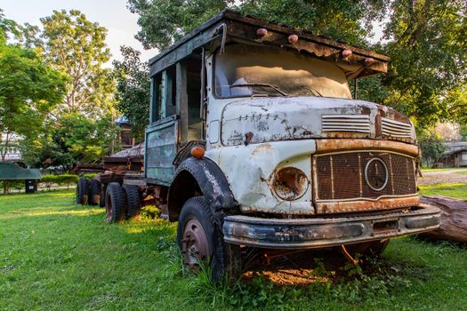 Rusty Old logging truck on old traditional farm area. Abandoned car, Selective focus.