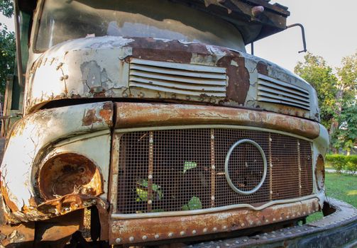 Front view of Rusty old logging truck. Abandoned car, selective focus.