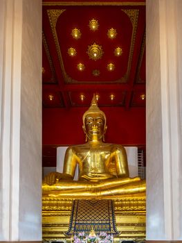 The buddha image in main vihan at Wihan Phra Mongkhon Bophit at Ayutthaya province of Thailand. Selective focus.