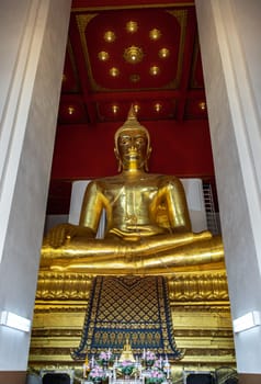 The buddha image in main vihan at Wihan Phra Mongkhon Bophit at Ayutthaya province of Thailand. Selective focus.