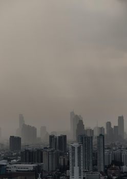 Bangkok, thailand - Nov 23, 2020 : View of Bangkok with city skyscrapers covered in a dense smog before a rain. Focus and blur.