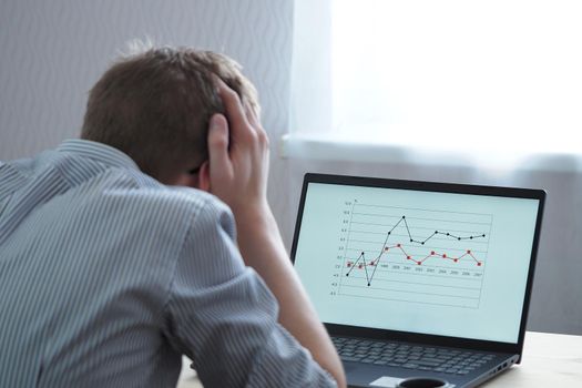 Distance learning, a young person, a student looks at, analyzes the schedule. High quality photo