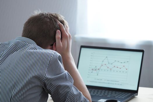 Distance learning, a young person, a student looks at, analyzes the schedule. High quality photo