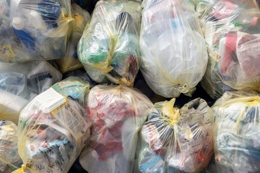 Household garbage piled up at a garbage collection point. It can be used as concepts and backgrounds.