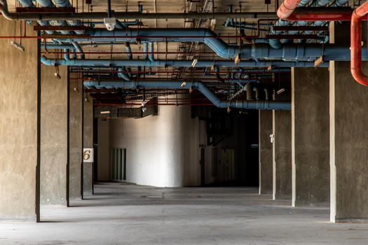 Parking garage interior Condominuim building on a bright sunlight sunny day, empty parking garage.