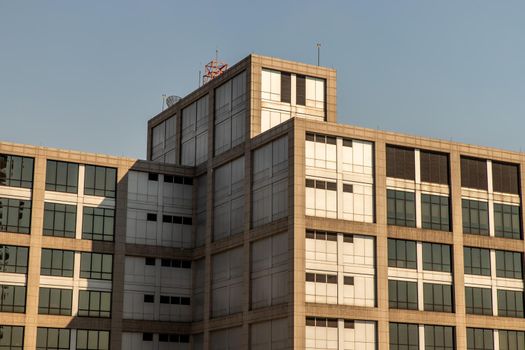 Bangkok, Thailand - Jan 04, 2020 : Abstract images of geometric shapes on buildings with repeating structure and reflected sky.